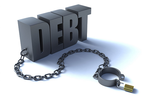 Picture of the word DEBT with shackle in 3d related to debt