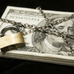 Picture of money with lock and chains