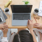 Professional women sitting in front of laptop