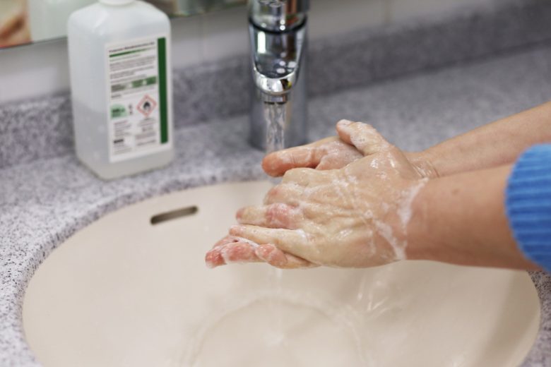 close-up hand washing with alcohol on counter r/t coronavirus outbreak
