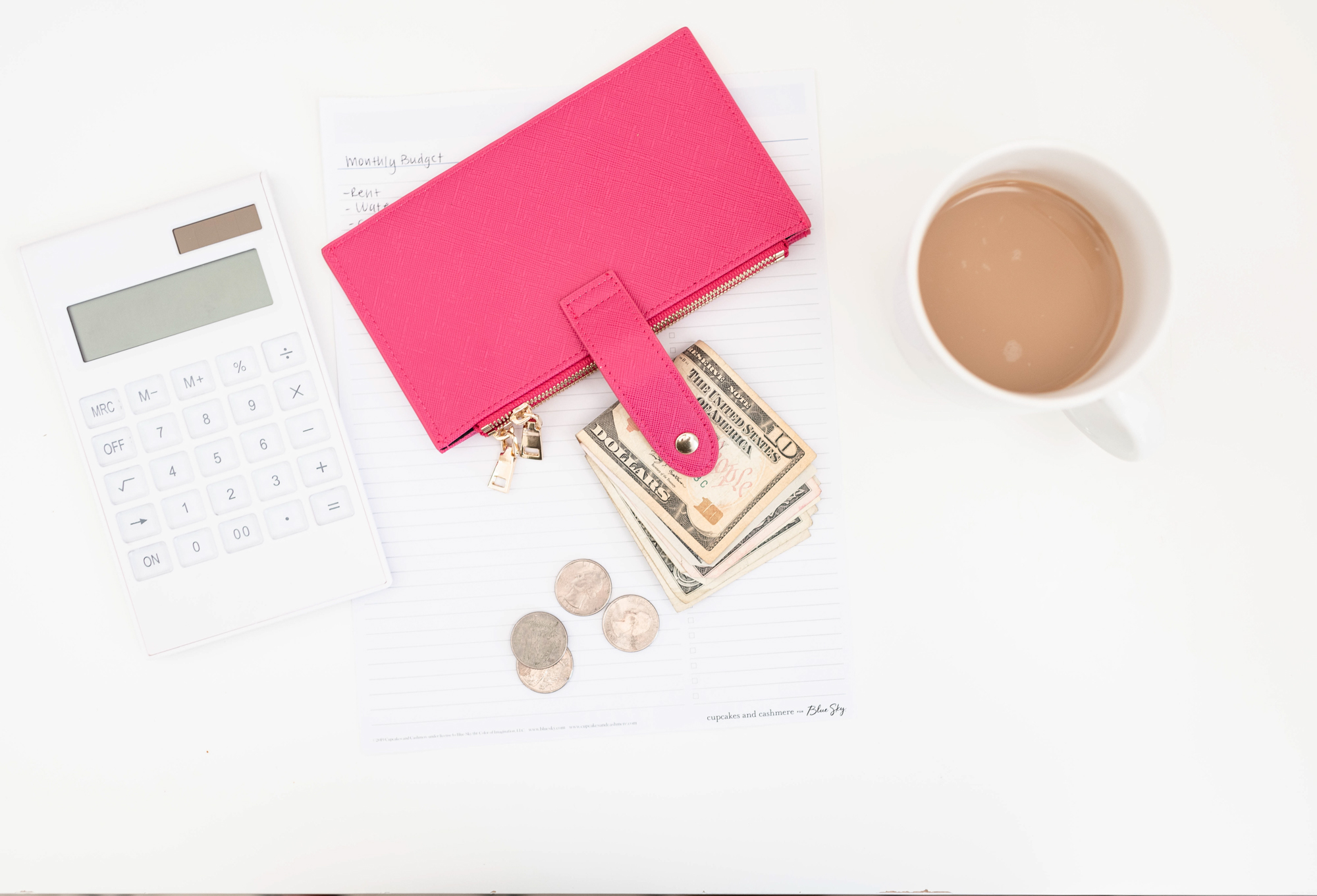 pink wallet, cash, and coffee mug r/t money