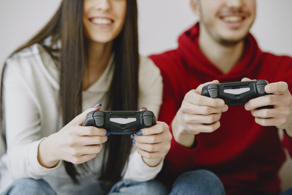 closeup of couple playing video game. r/t holiday season