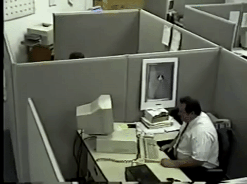Giphy of angry man in a cubicle smashing a computer r/t financial security.