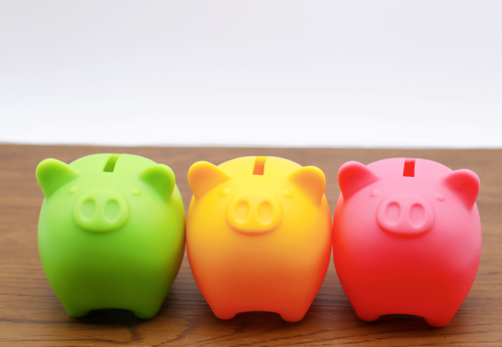 Closeup of three piggy banks r/t teaching kids about money