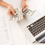 5 Inspiring Ways to Reach Your Financial Goals Using the Law of Attraction cash laptop money dollars law of attraction feature