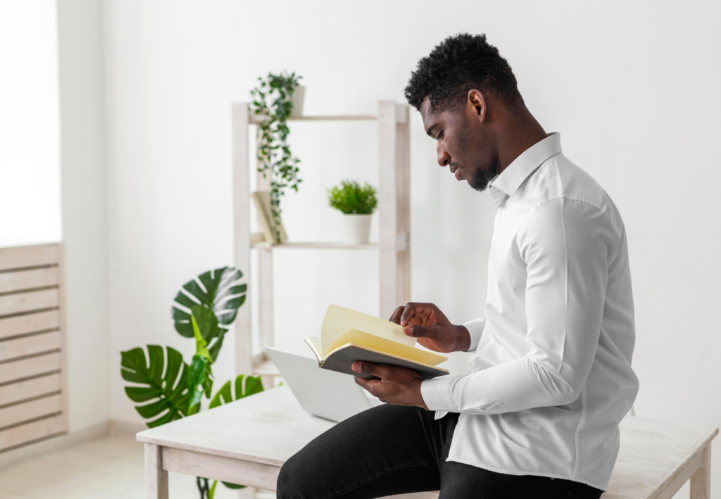 Man sitting with book r/t reading books